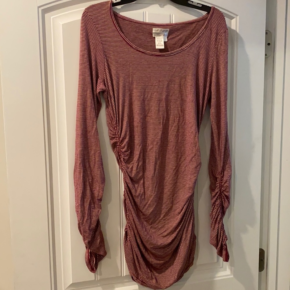 Long stretchy shirt. Purchased from Dillards. Condition is good.